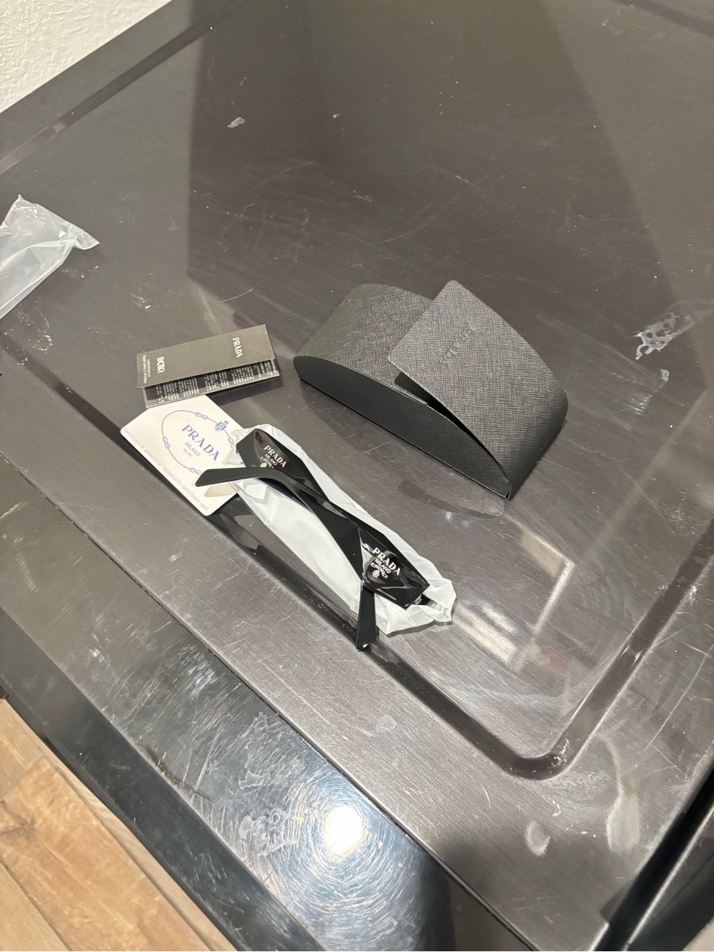 Prada Black Sunglasses with Textured Gray Case